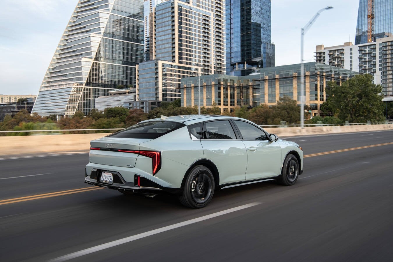 Kia K4 rear three-quarter exterior view