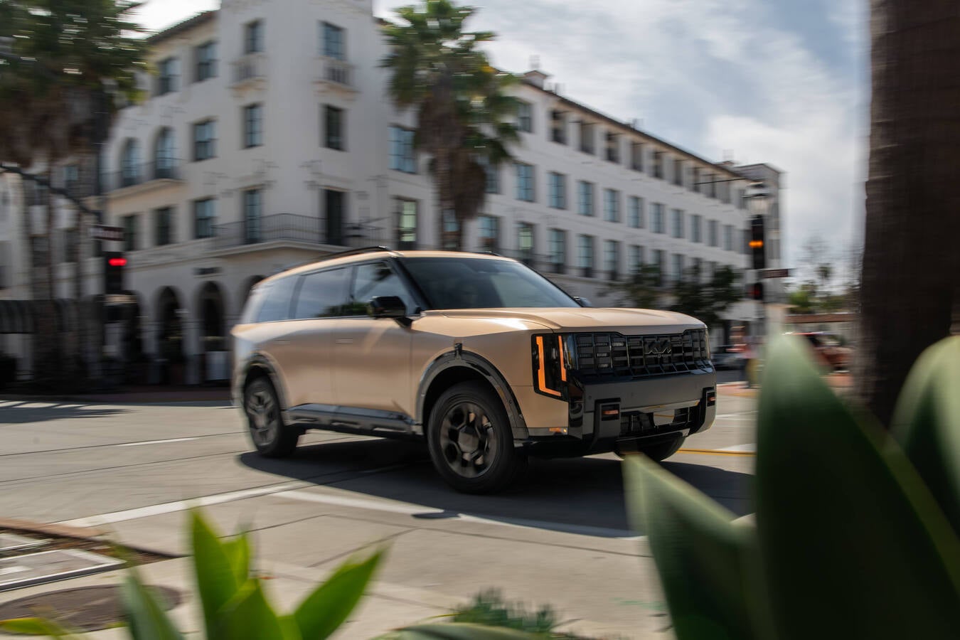 2027 Kia Telluride in front of a modern building