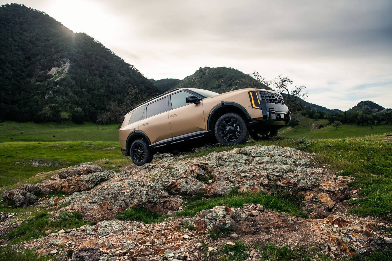 2027 Kia Telluride X-Pro on a rugged hill